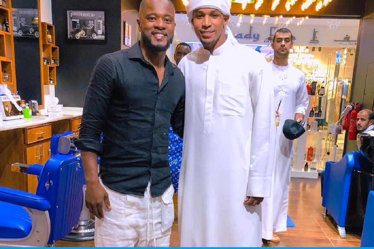 Ahmed with Patrice Evra at MK Barbershop