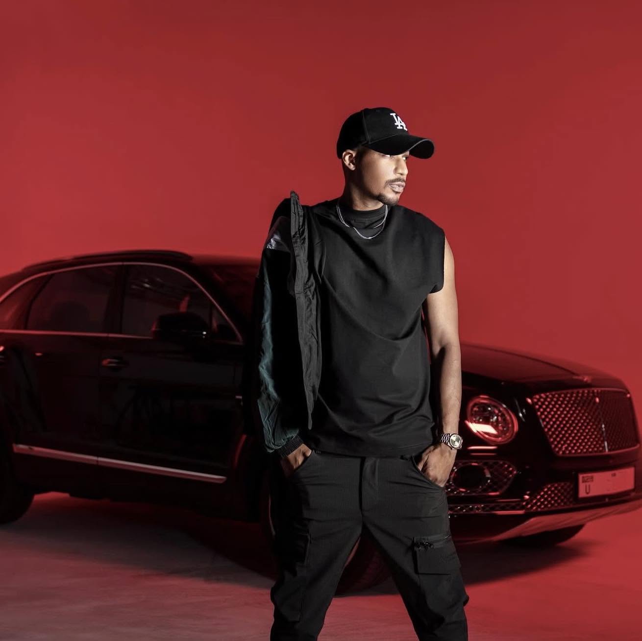 Ahmed Khalfan Yasin dressed in black at a jewellery showroom